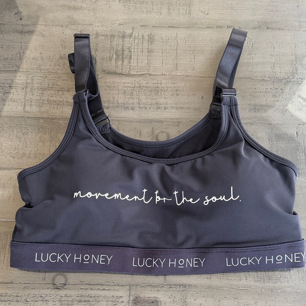 Women's Black Sports Bra - Movement for the Soul. Size L. Has Bra pad Inserts